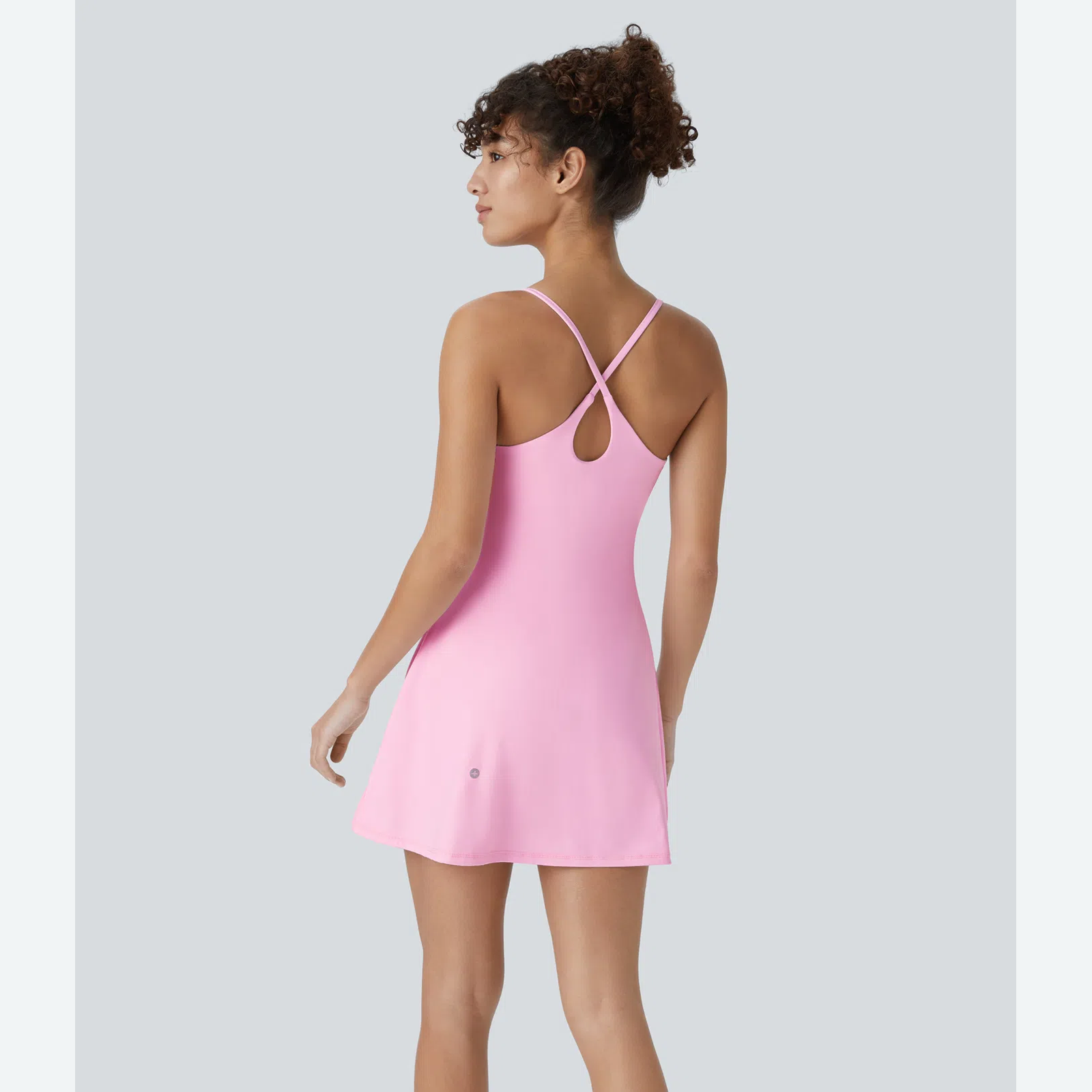 Back view showing crisscross teardrop strap design