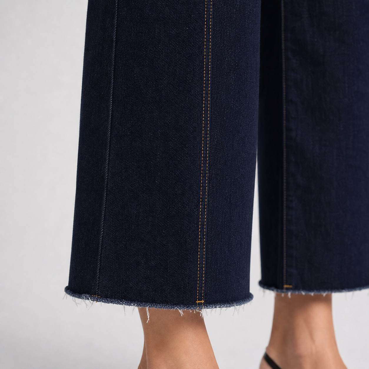 Raw frayed cropped hem and denim twill texture detail