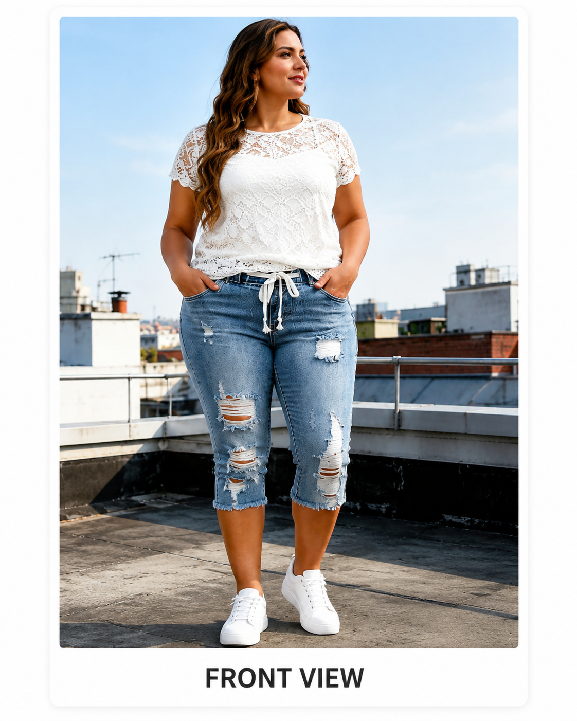 front view of light blue distressed capri jeans
