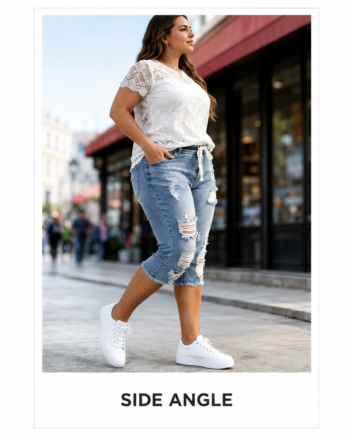 side angle view of distressed capri jeans
