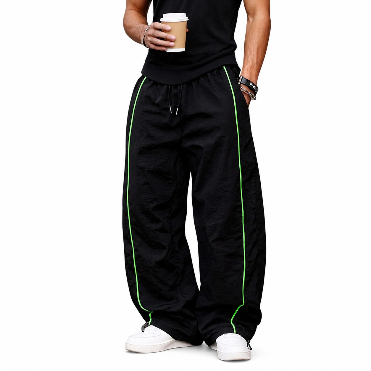 Black wide-leg pants with green piping front view.