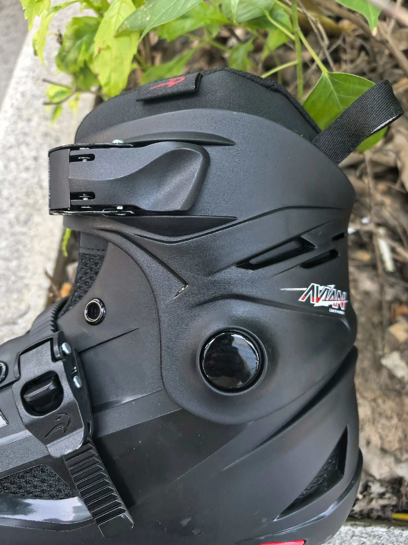 Close-up of the black Flying Eagle inline skate shell, cuff buckle and instep fastening