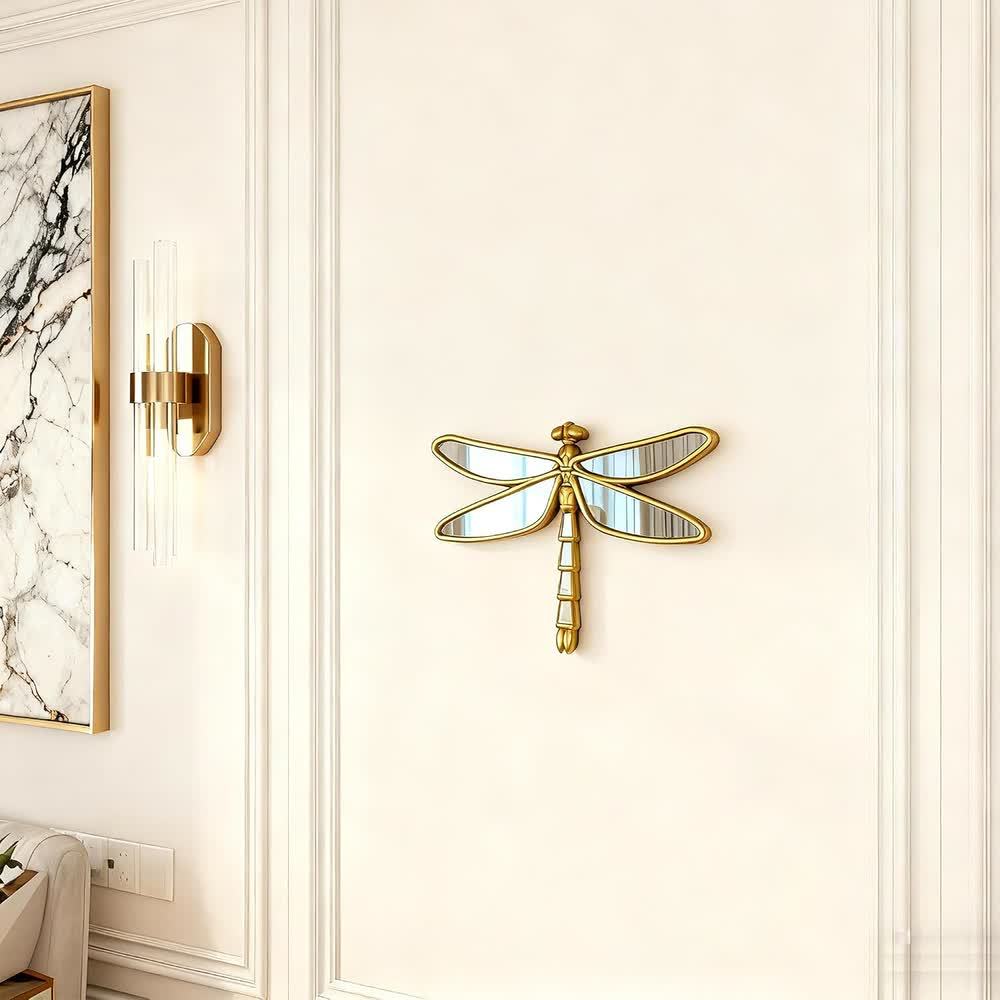 Dragonfly mirror displayed on a paneled wall