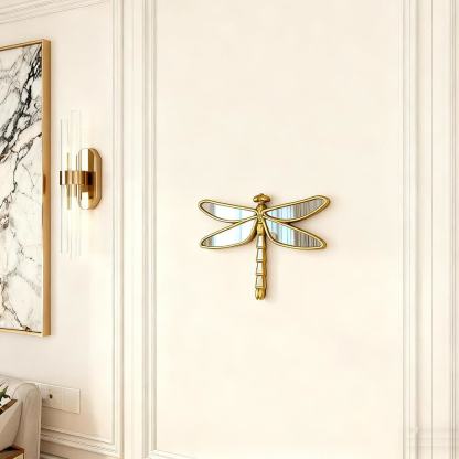 Dragonfly mirror displayed on a paneled wall