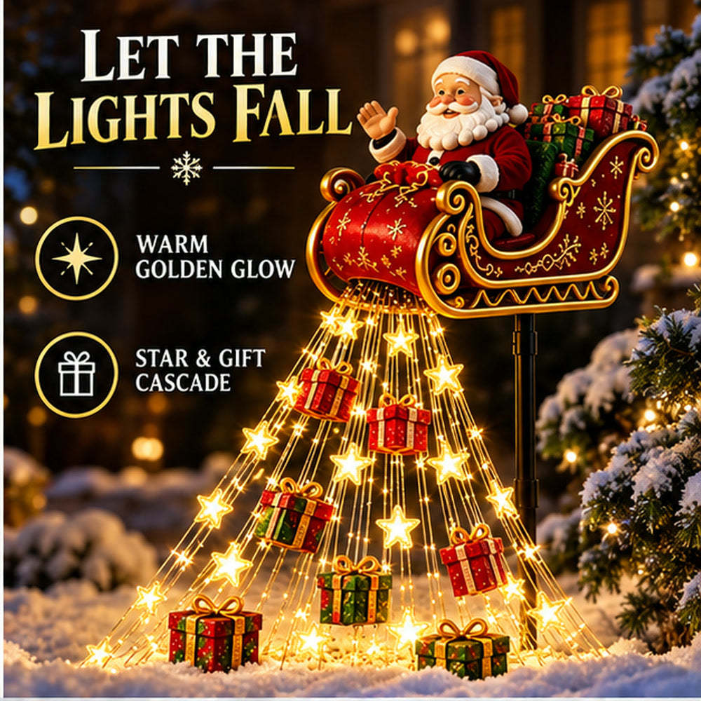 Close view of the red-and-gold Santa sleigh above the glowing cascade