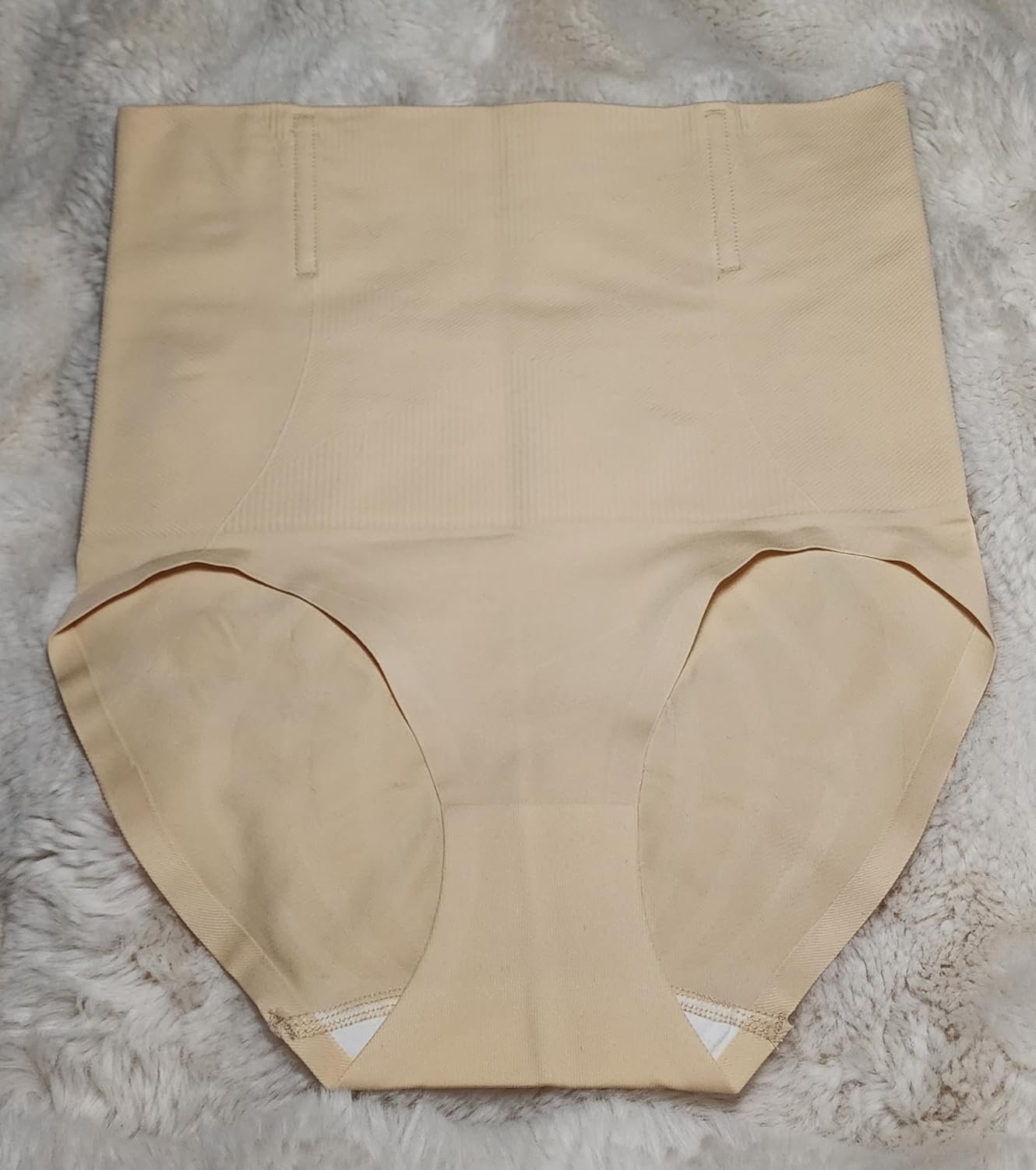 Well‑built shapewear, but missed the mark on my mom‑pooch camouflaging quest