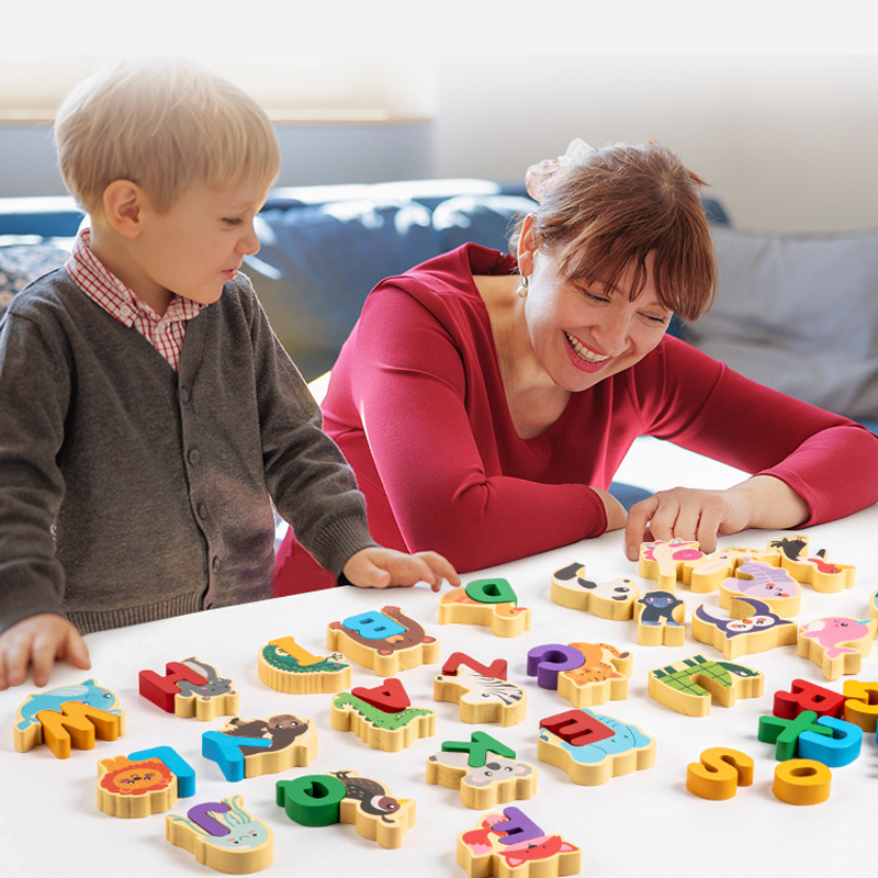 Original family play image showing the graspable letters in use