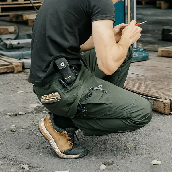 Lightweight work pants during a kneeling task