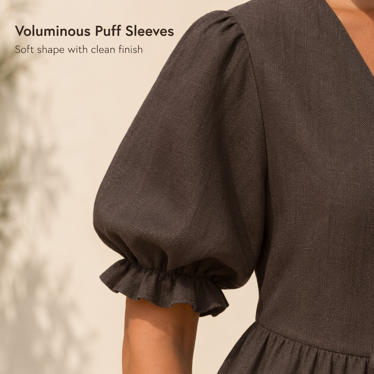 Close view of puff sleeve and ruffle cuff detail