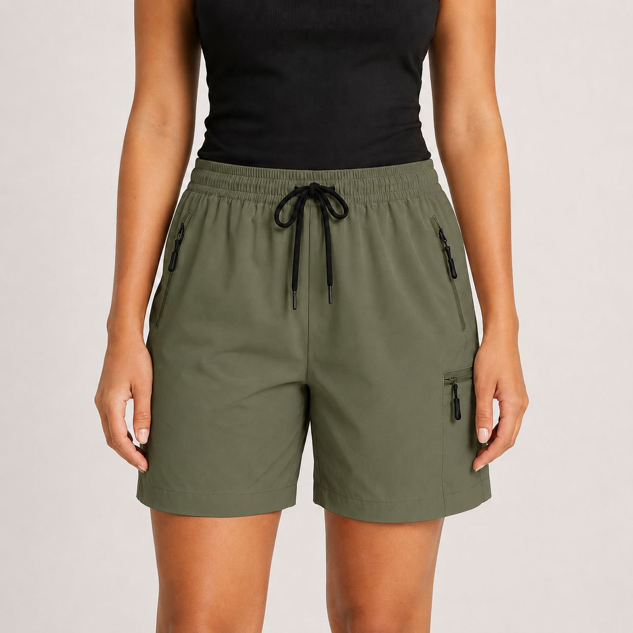 Olive green lightweight drawstring cargo shorts on model