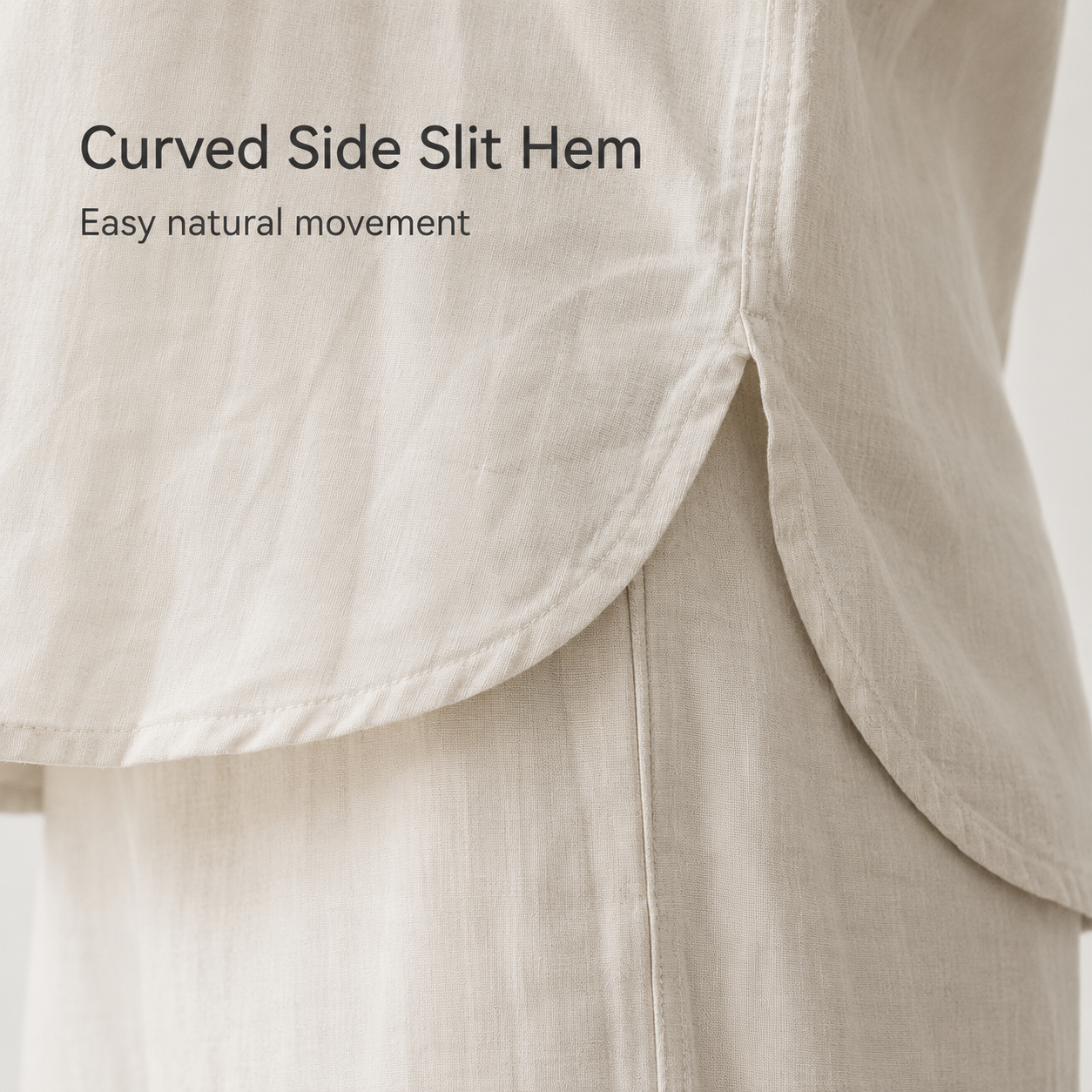 Curved side-slit hem detail on relaxed top