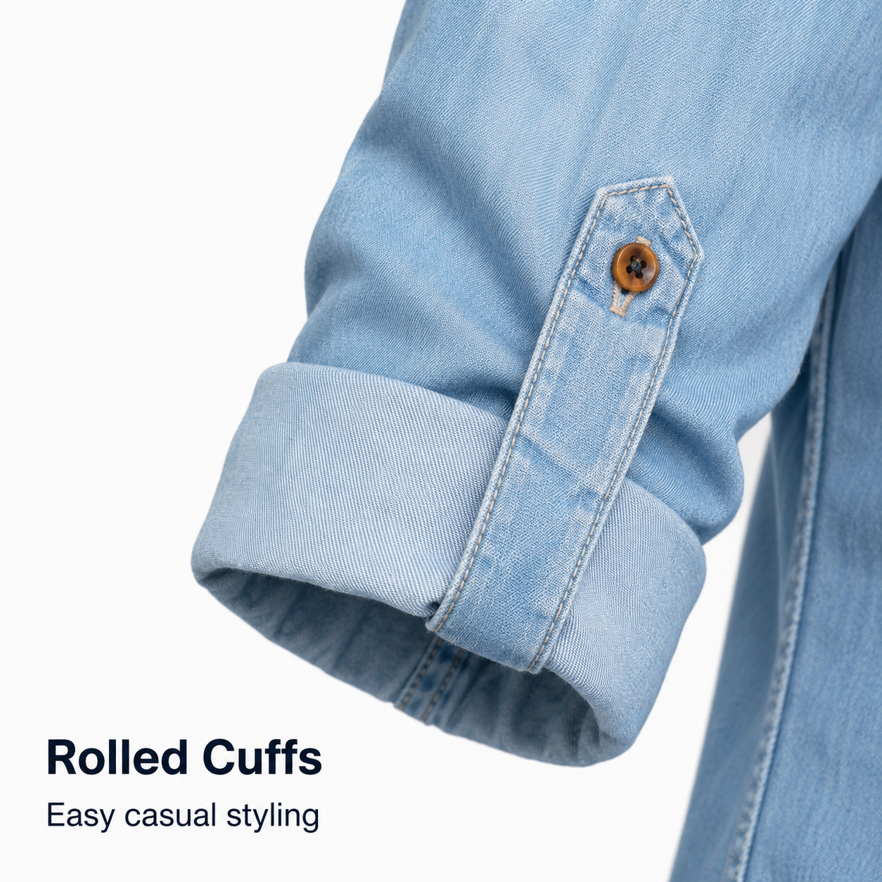 Rolled cuff detail on denim button-up shirt