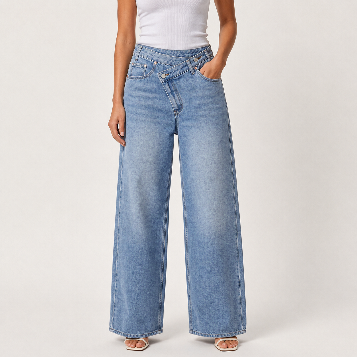Light wash blue asymmetric wide leg denim jeans