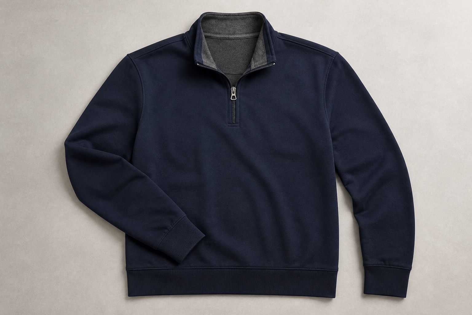 Navy soft jersey quarter-zip pullover showing collar, zipper, cuffs and ribbed hem