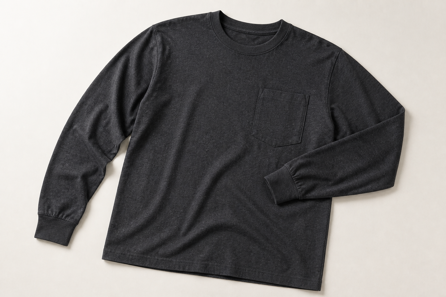 Charcoal heather long-sleeve pocket T-shirt showing crew neck, pocket, cuffs and straight hem