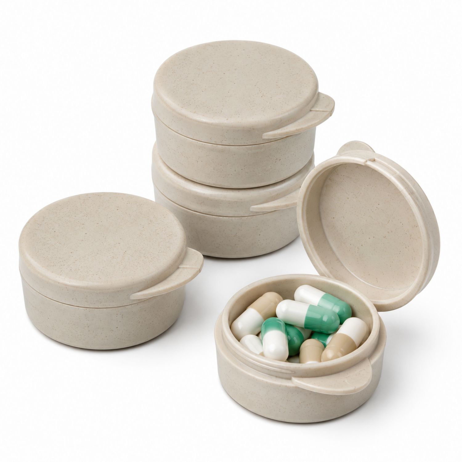 Runde beige Pillendose mit vier Fächern und Drehdeckel