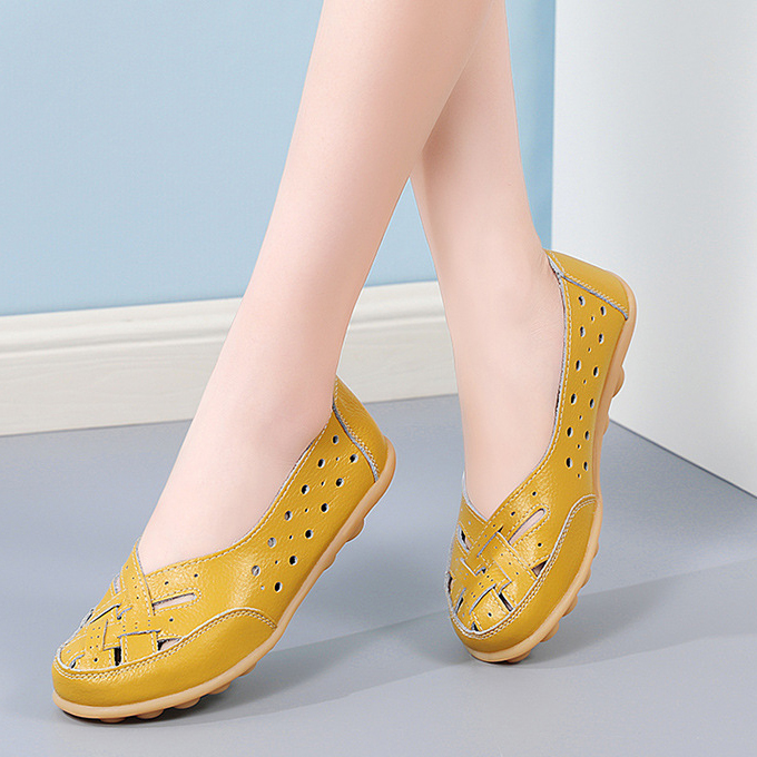 Green casual slip-on flats styled with jeans