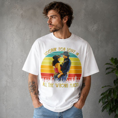 Retro Western Cowboy Romance Graphic Tee – Vintage “Lookin’ for Love in All the Wrong Places” Sunset Shirt