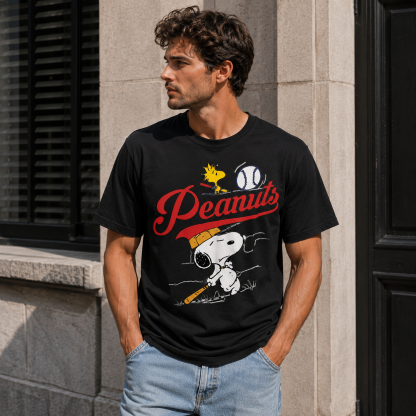 Retro Baseball-Inspired Graphic T-Shirt — A streetwear-style, sporty short-sleeve tee featuring a "Peanuts" logo in retro script alongside a cartoon illustration of a batter.
