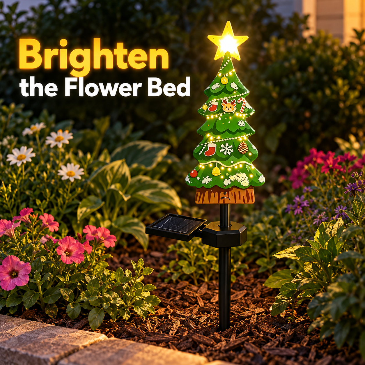 Tree-shaped solar stake light glowing in a flower bed