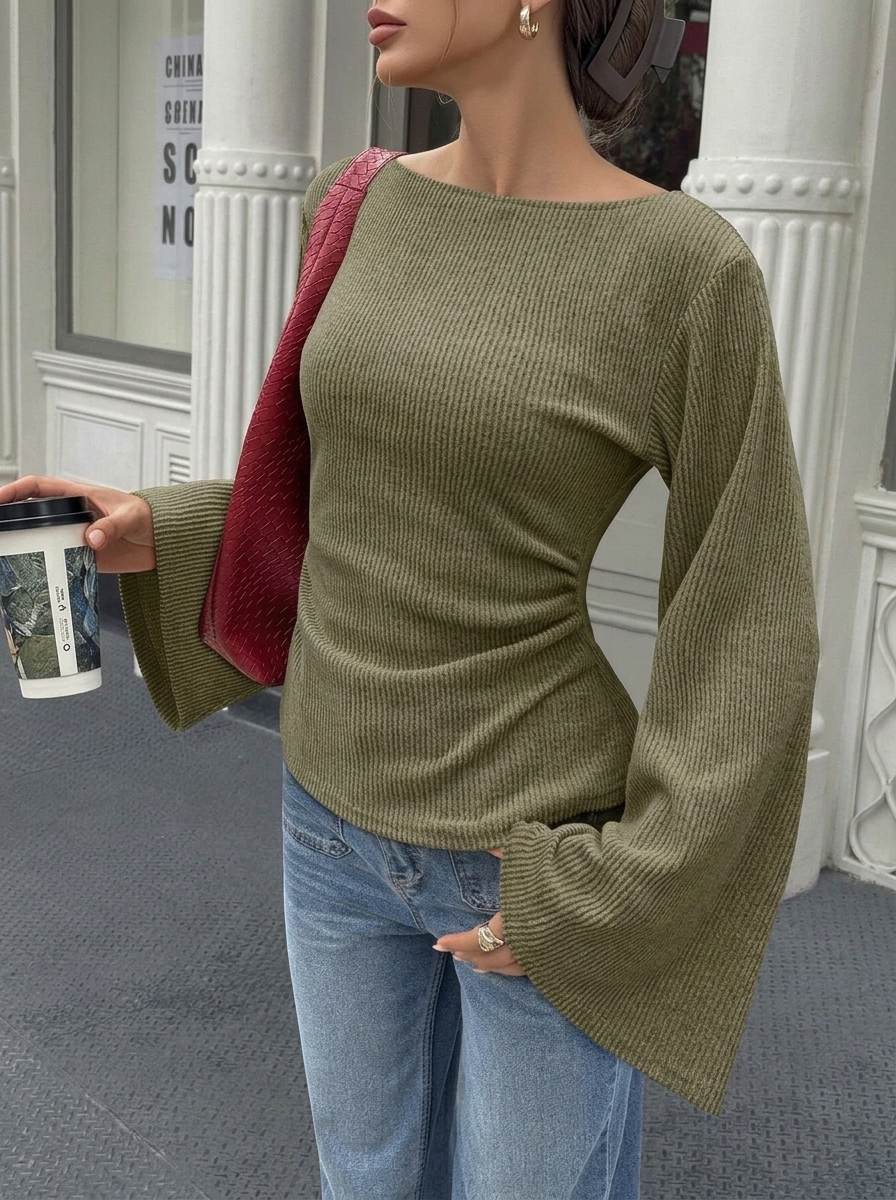 Solid color flared long-sleeve top with off-shoulder neckline and cinched waist