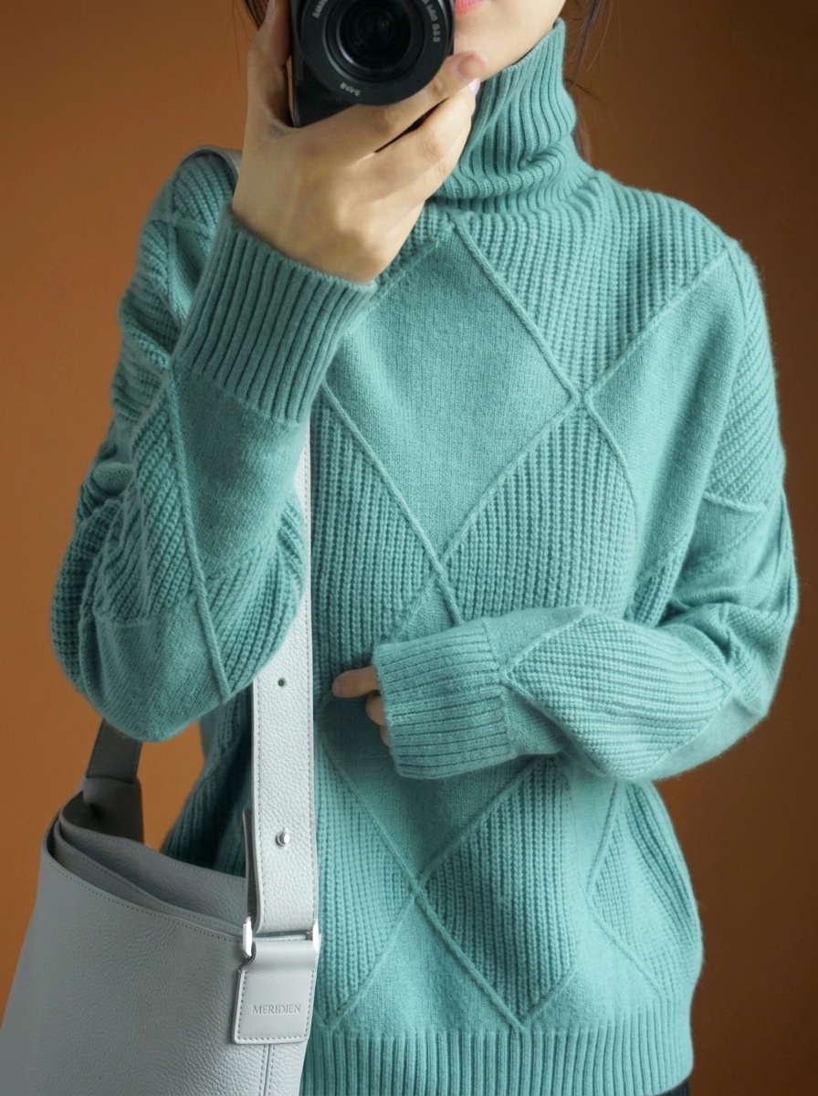 Solid color pullover sweater with diamond pattern and smooth texture