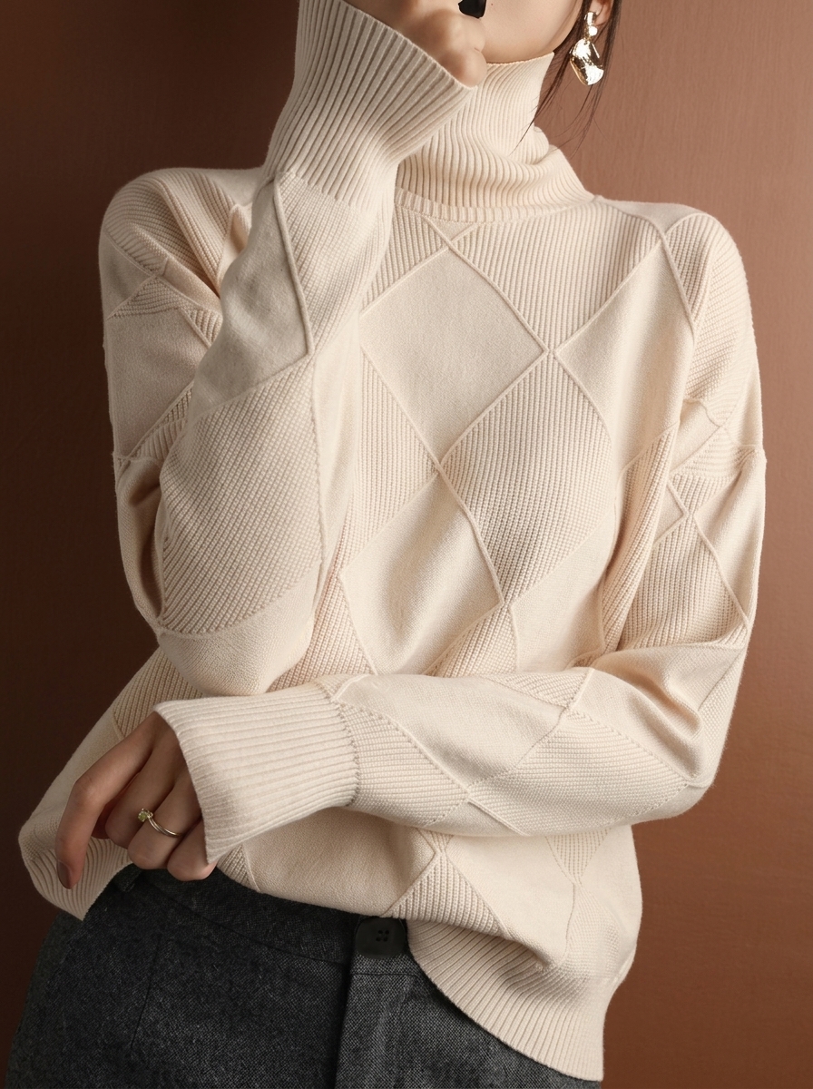 Solid color pullover sweater with diamond pattern and smooth texture