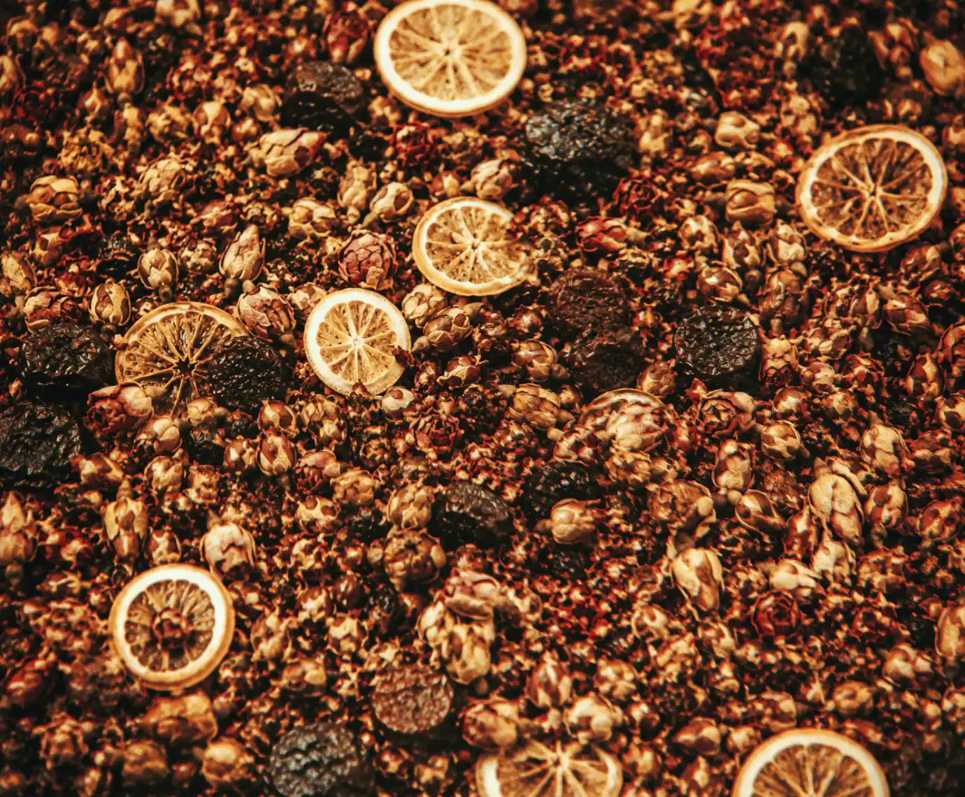 Close-up of dark brown wood chips with textured grain.