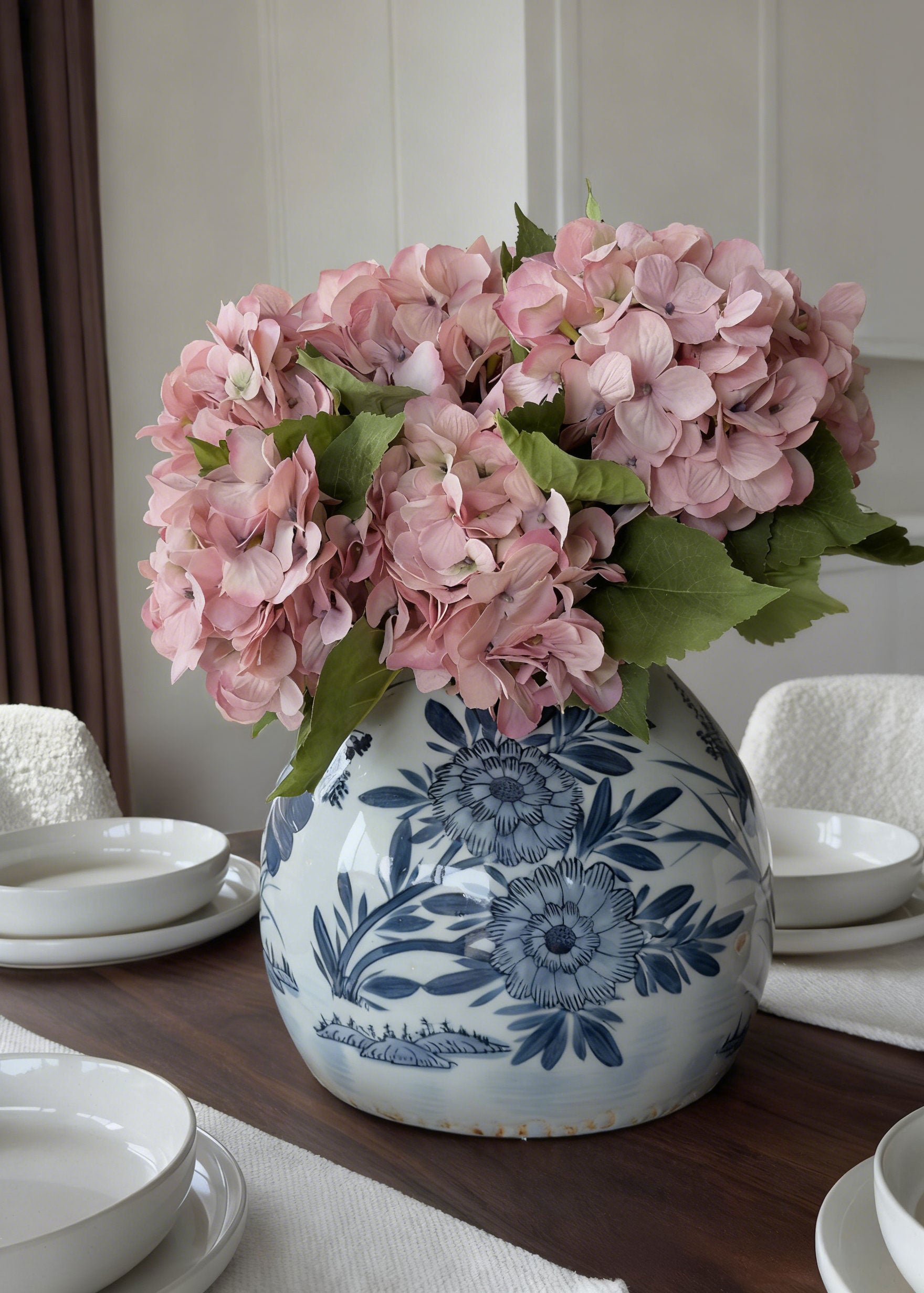 blue and white ginger vase with pink hydrangea flowers