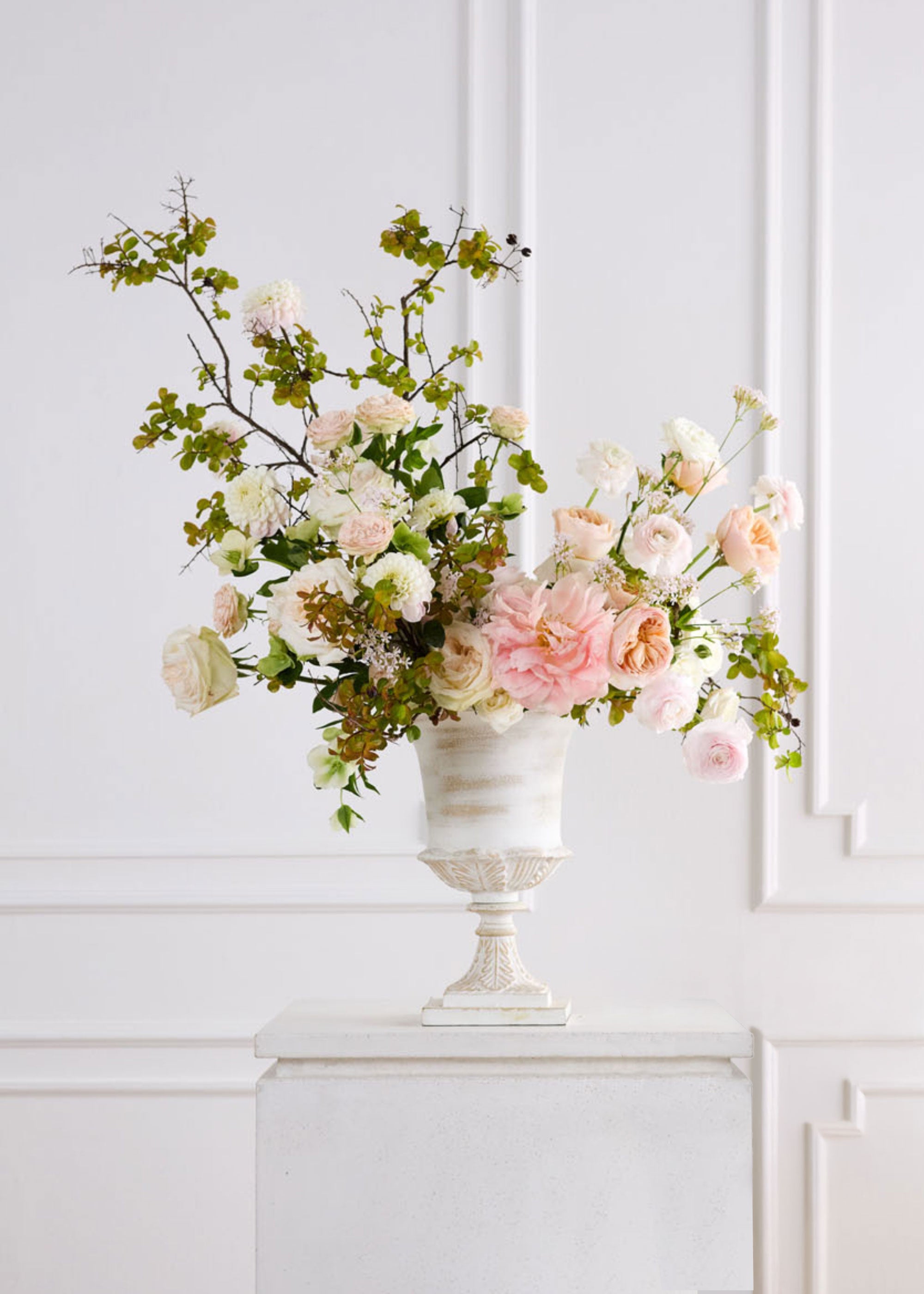 Floral arrangement in a decorative urn vase