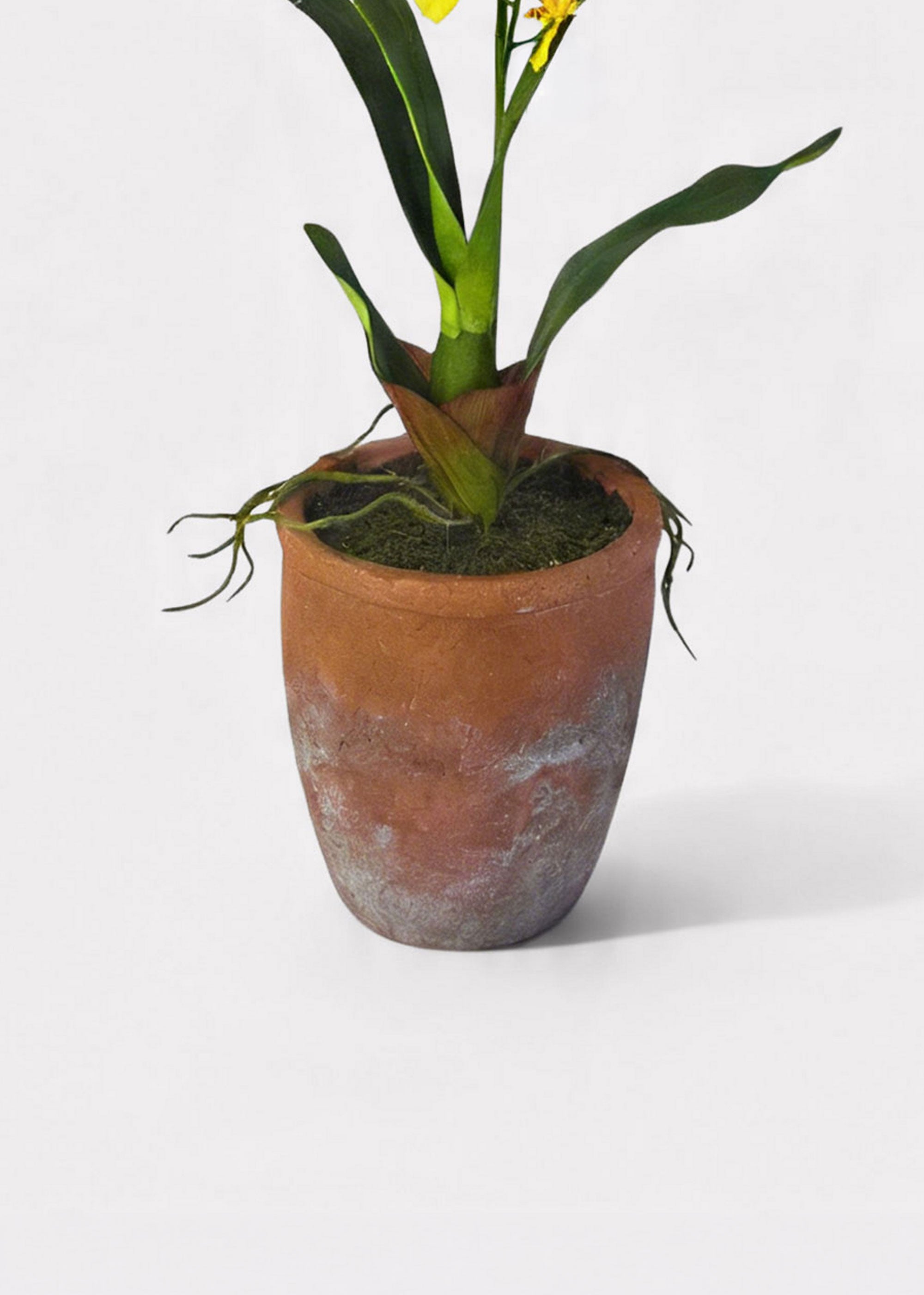 Clay pot with fake dirt and artificial orchid