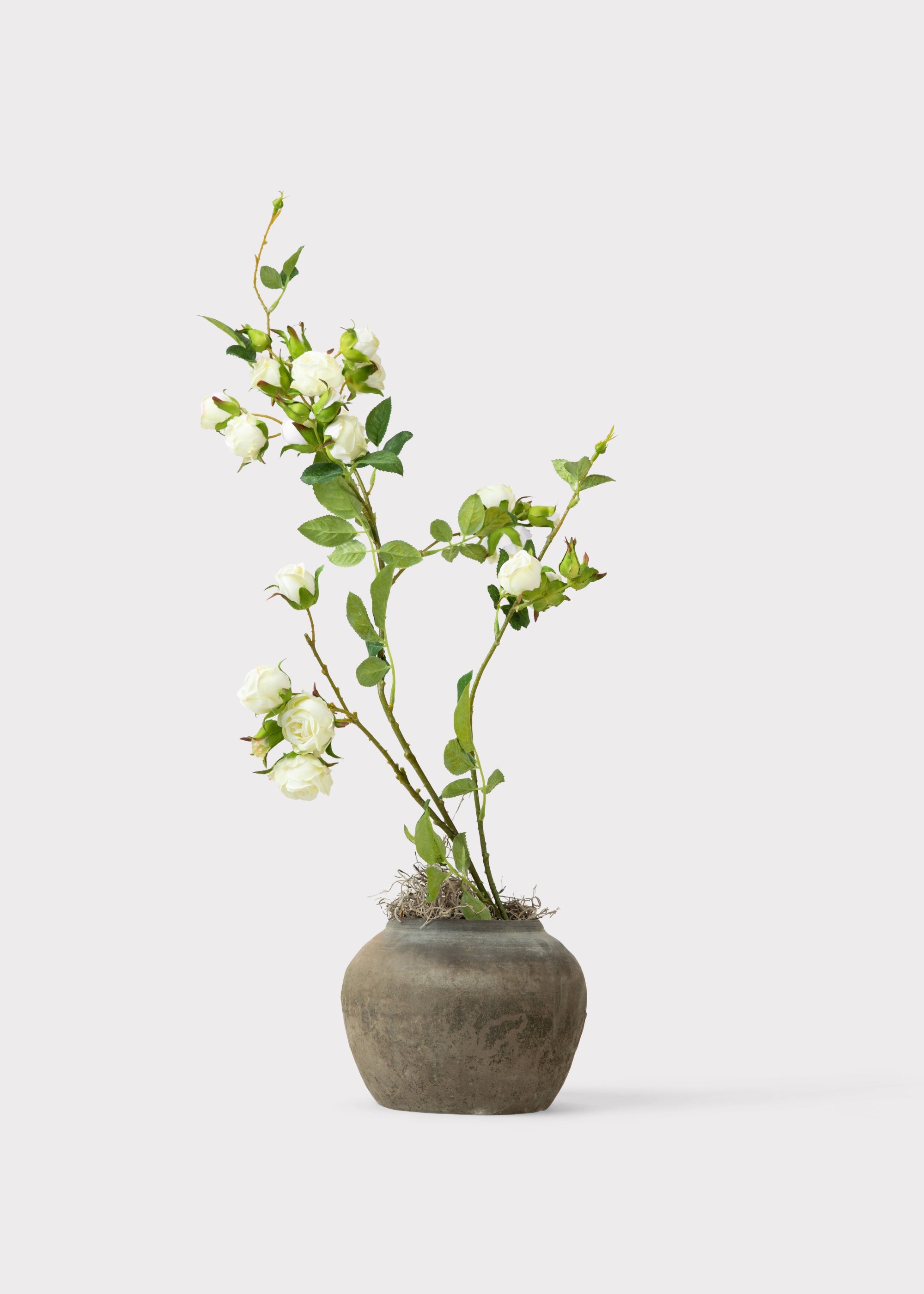 Faux Roses Arranged in Rustic Pot