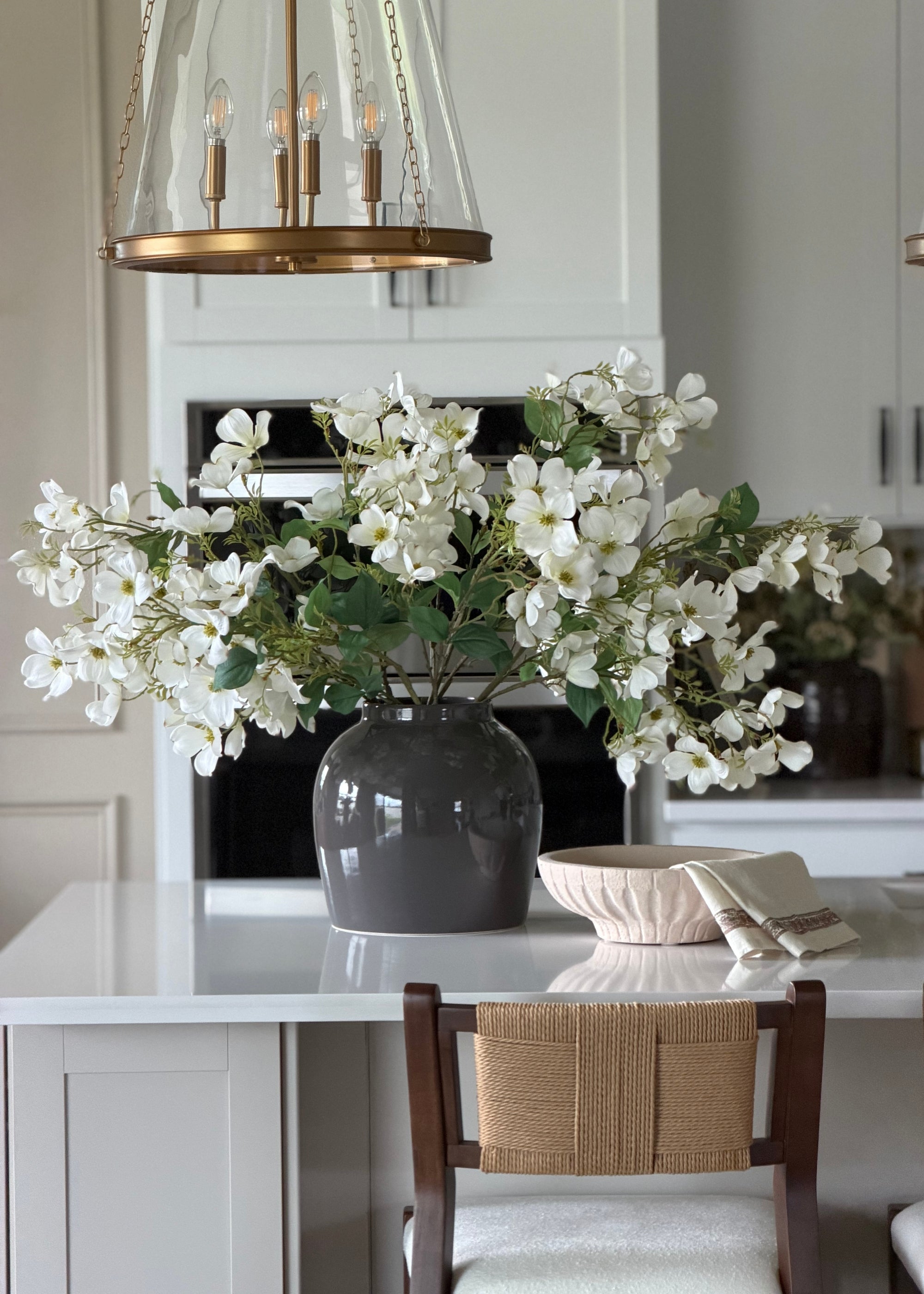 artificial dogwood branches styled in the afloral slate gray vase