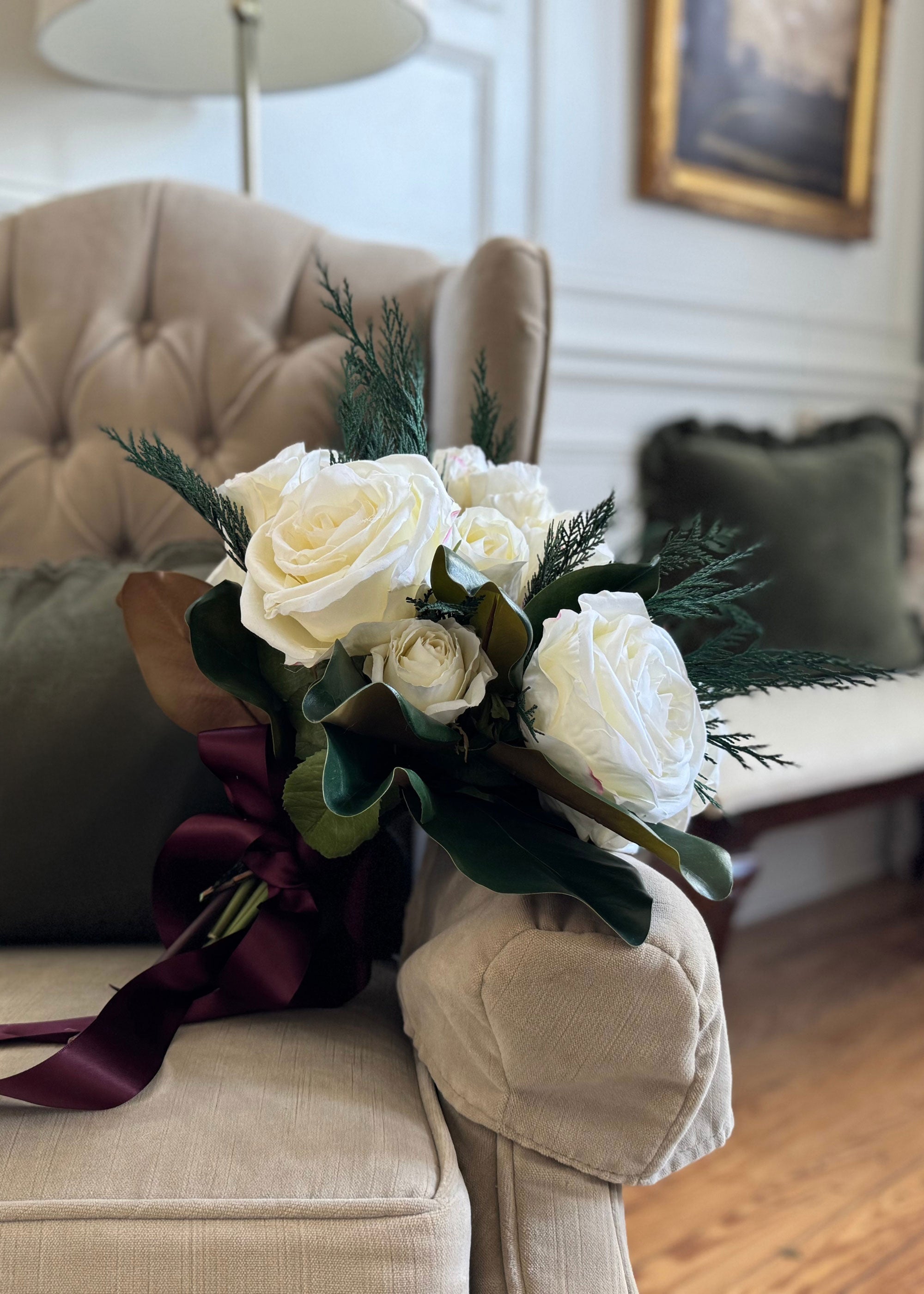 Bouquet of white roses with greenery