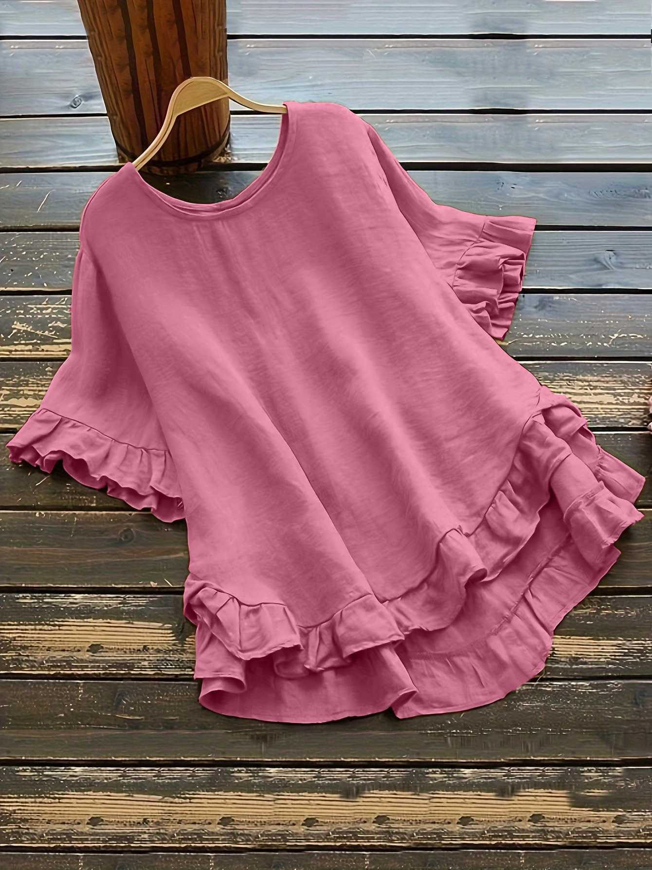 Buttonless ice silk ruffled hem top with front short and back long design, bell sleeves, and round neck