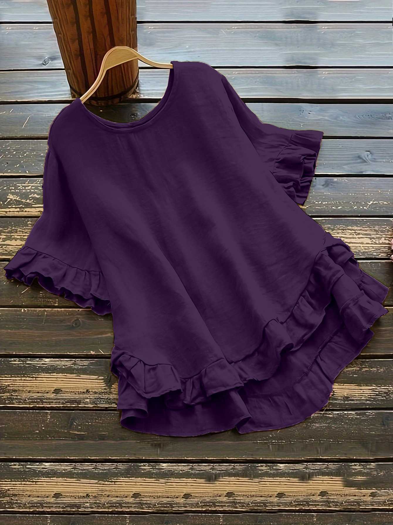 Buttonless ice silk ruffled hem top with front short and back long design, bell sleeves, and round neck