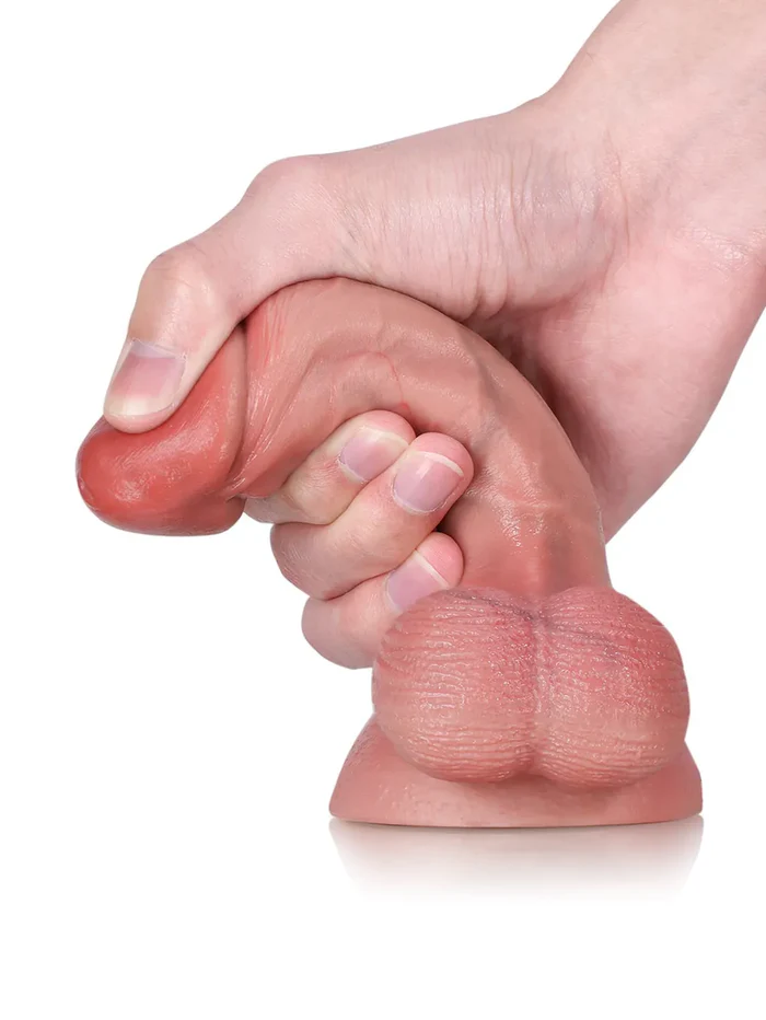 Smi 6 x 1.3 in — A compact, soft, and realistic dildo featuring swinging, pendulous testicles.