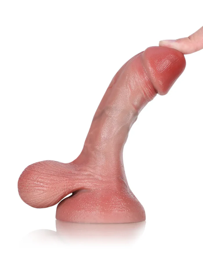 Smi 6 x 1.3 in — A compact, soft, and realistic dildo featuring swinging, pendulous testicles.