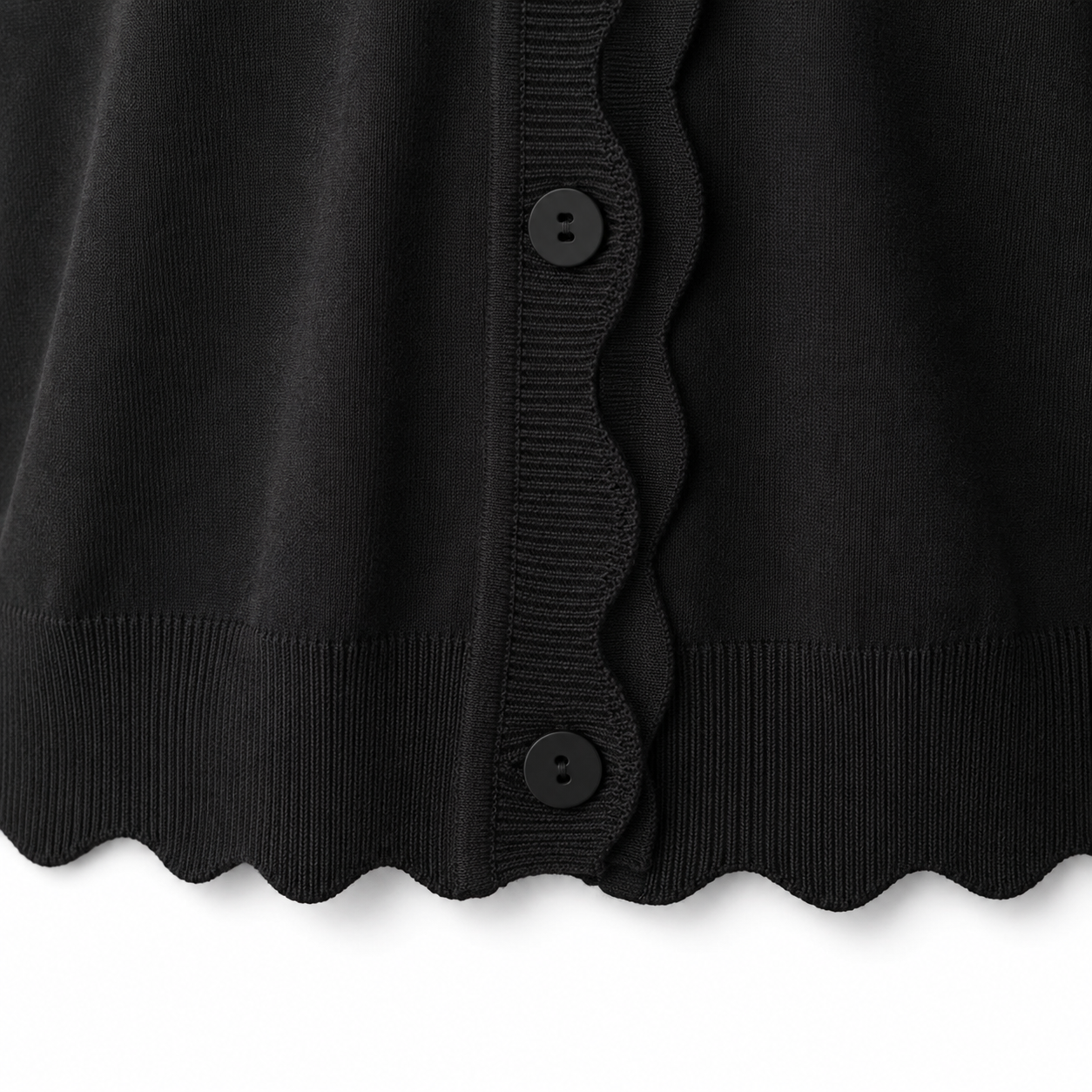 Rib-knit scalloped hem and lower placket detail