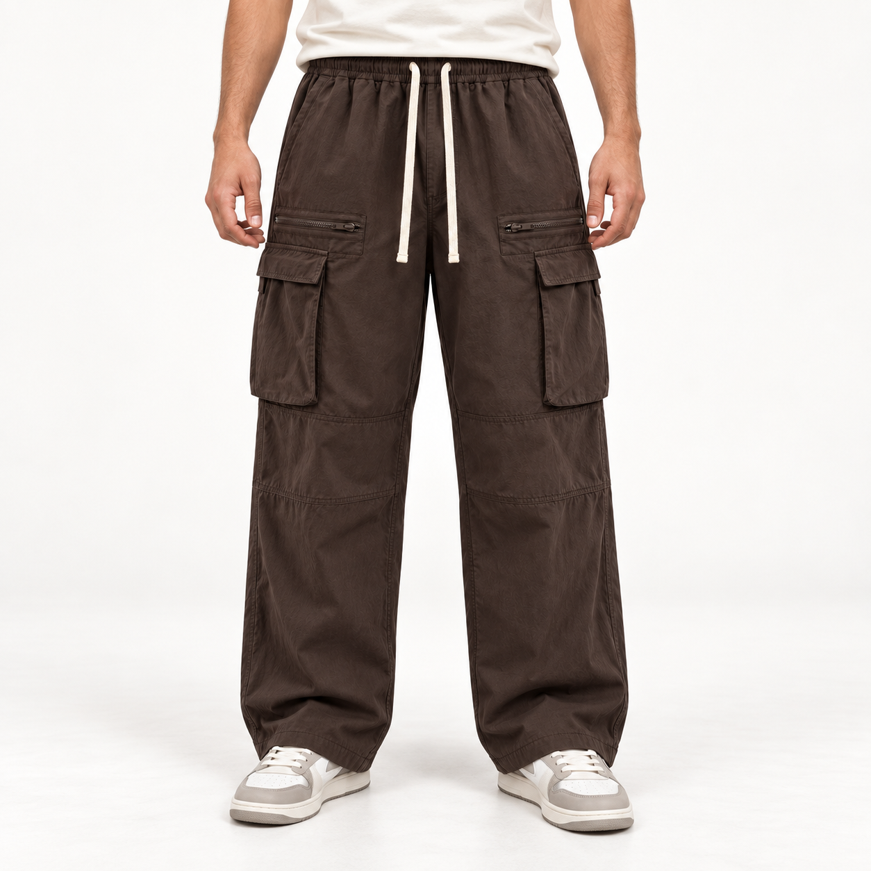 Front view of a male model wearing Dark Brown loose-fit drawstring cargo pants