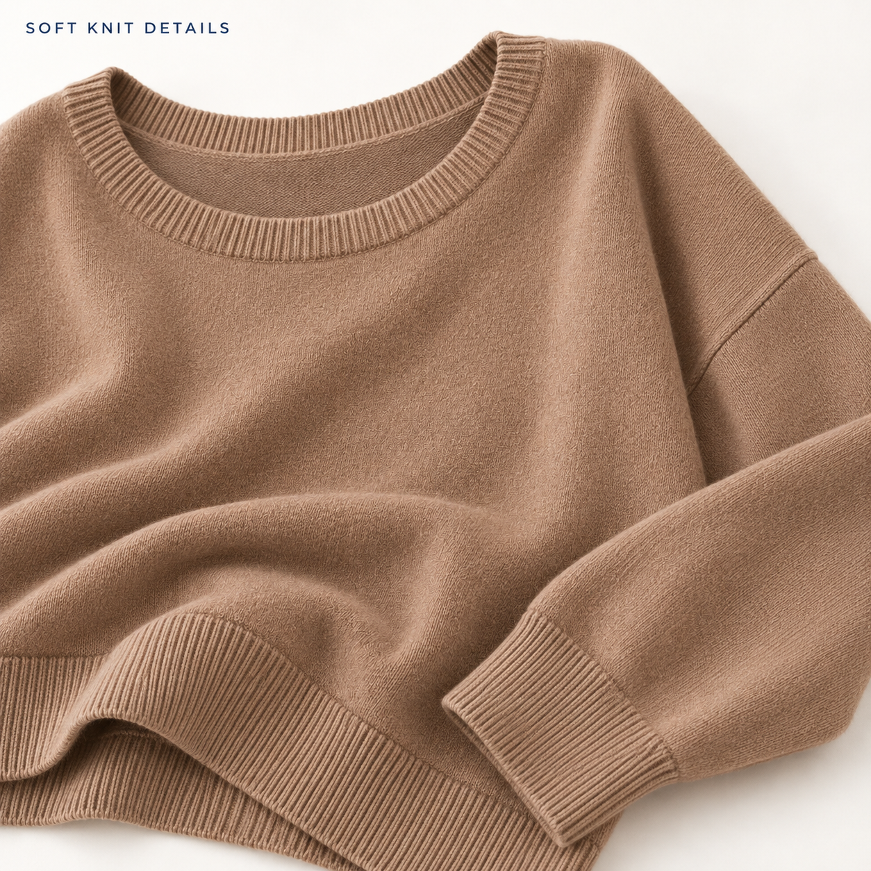 Close-up of the soft knit texture and ribbed sweater construction