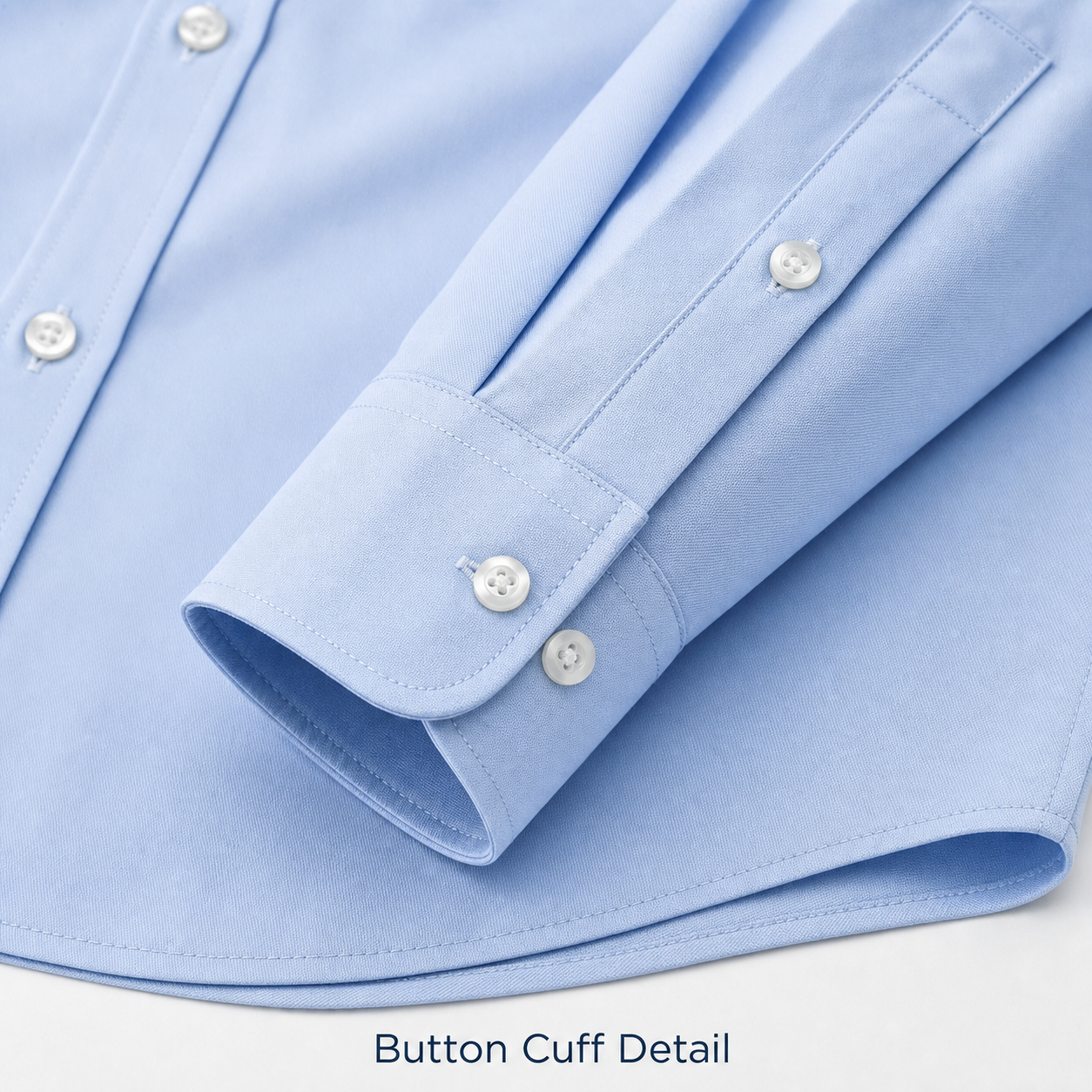 Men's dress shirt button cuff and clean stitching detail