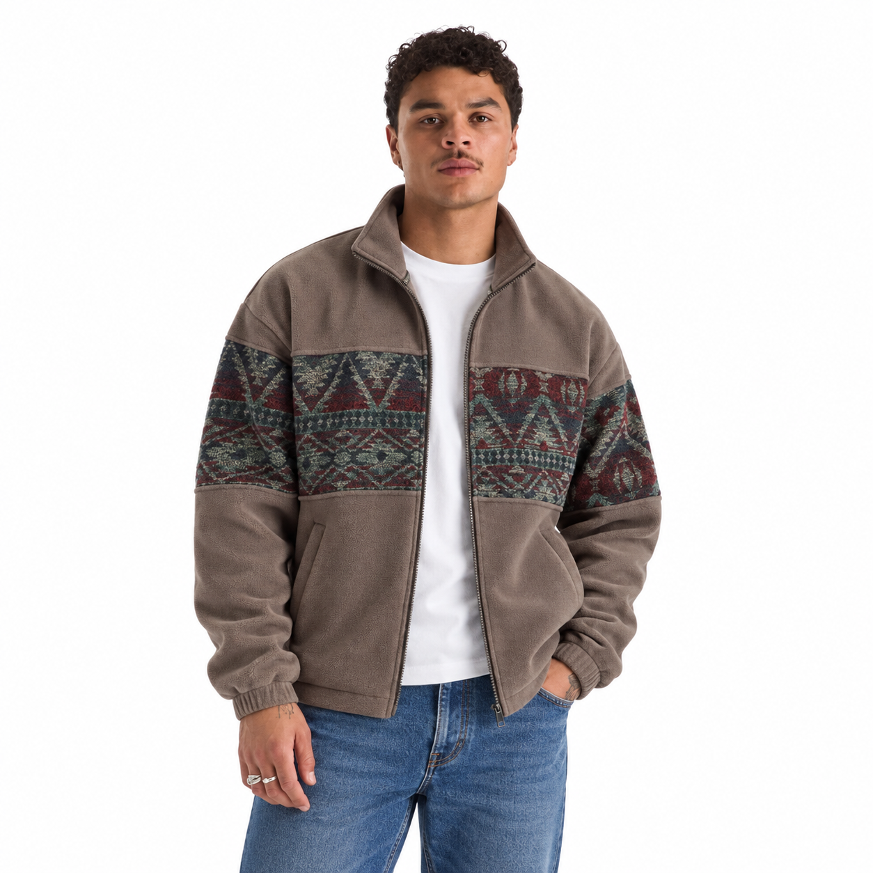 Taupe ethnic-pattern fleece jacket modeled with classic denim