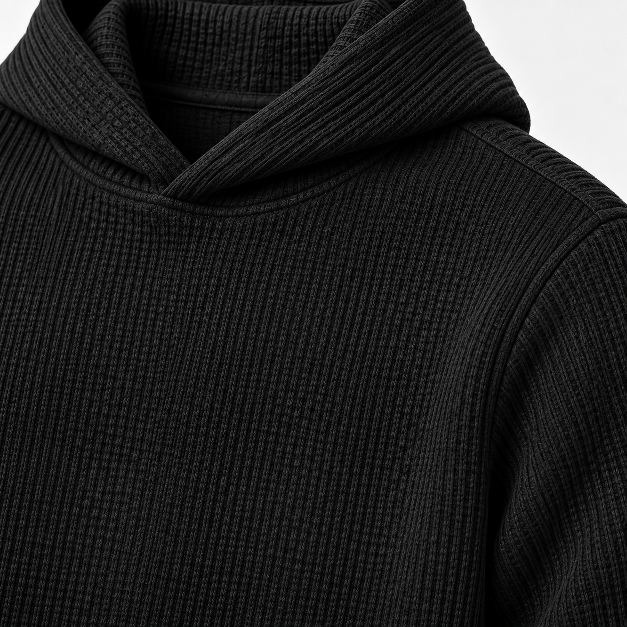 Black waffle knit fabric and stitching close-up