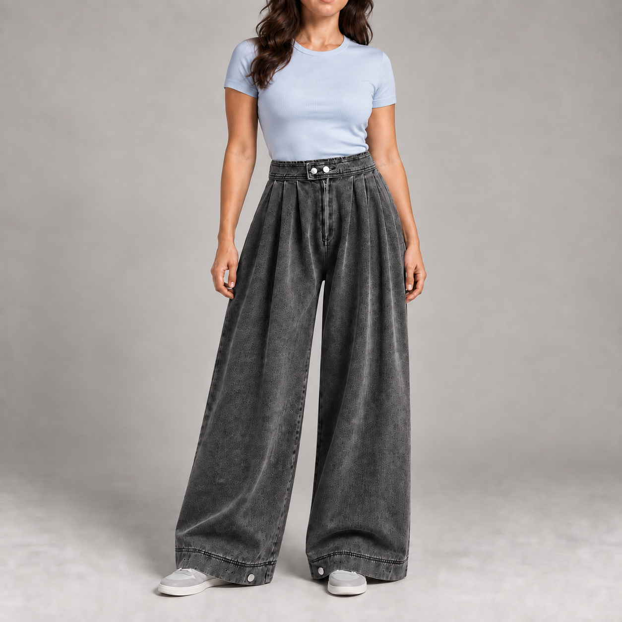 Woman wearing the Washed Black pleated balloon jeans color option