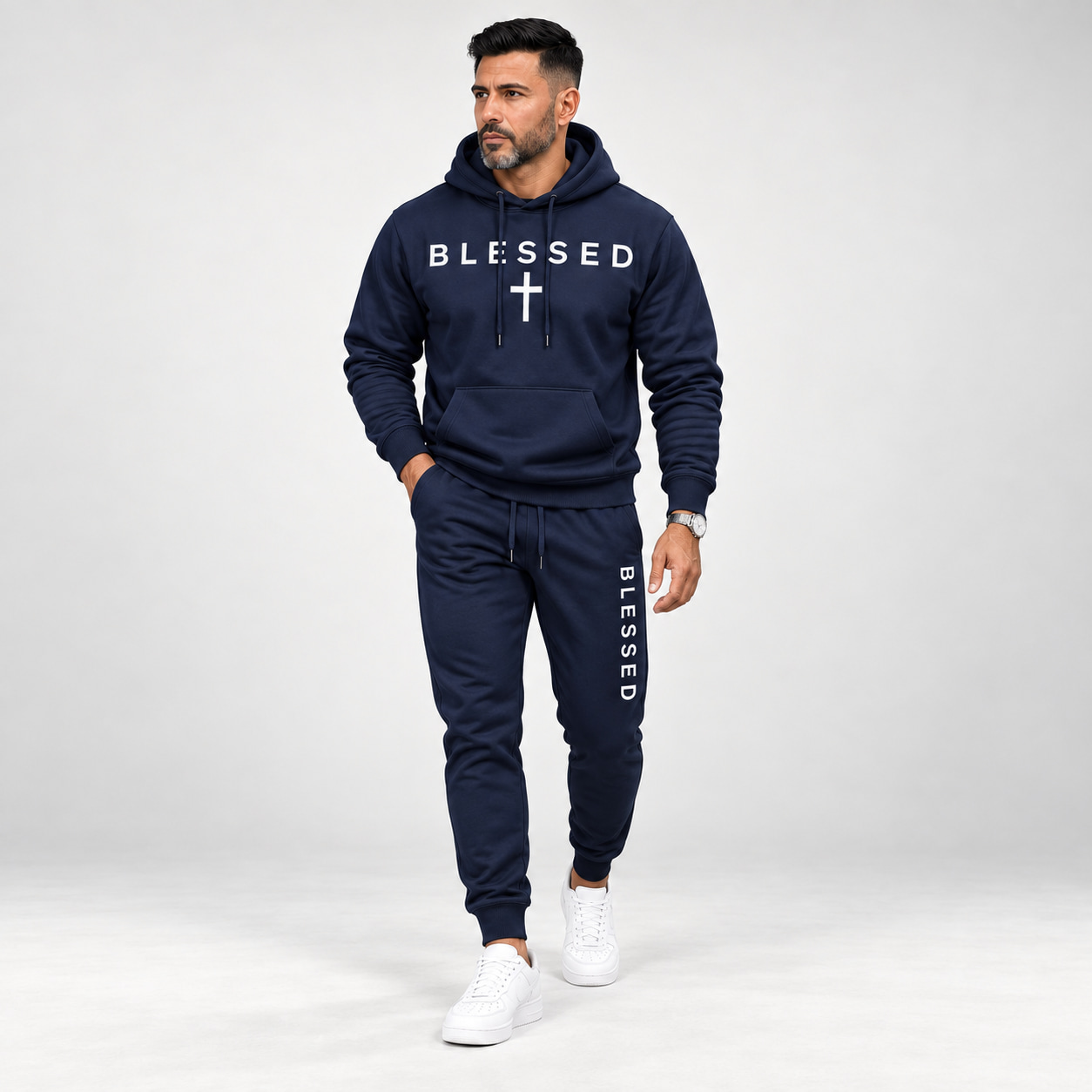 Adult male wearing the Navy BLESSED hoodie and jogger set