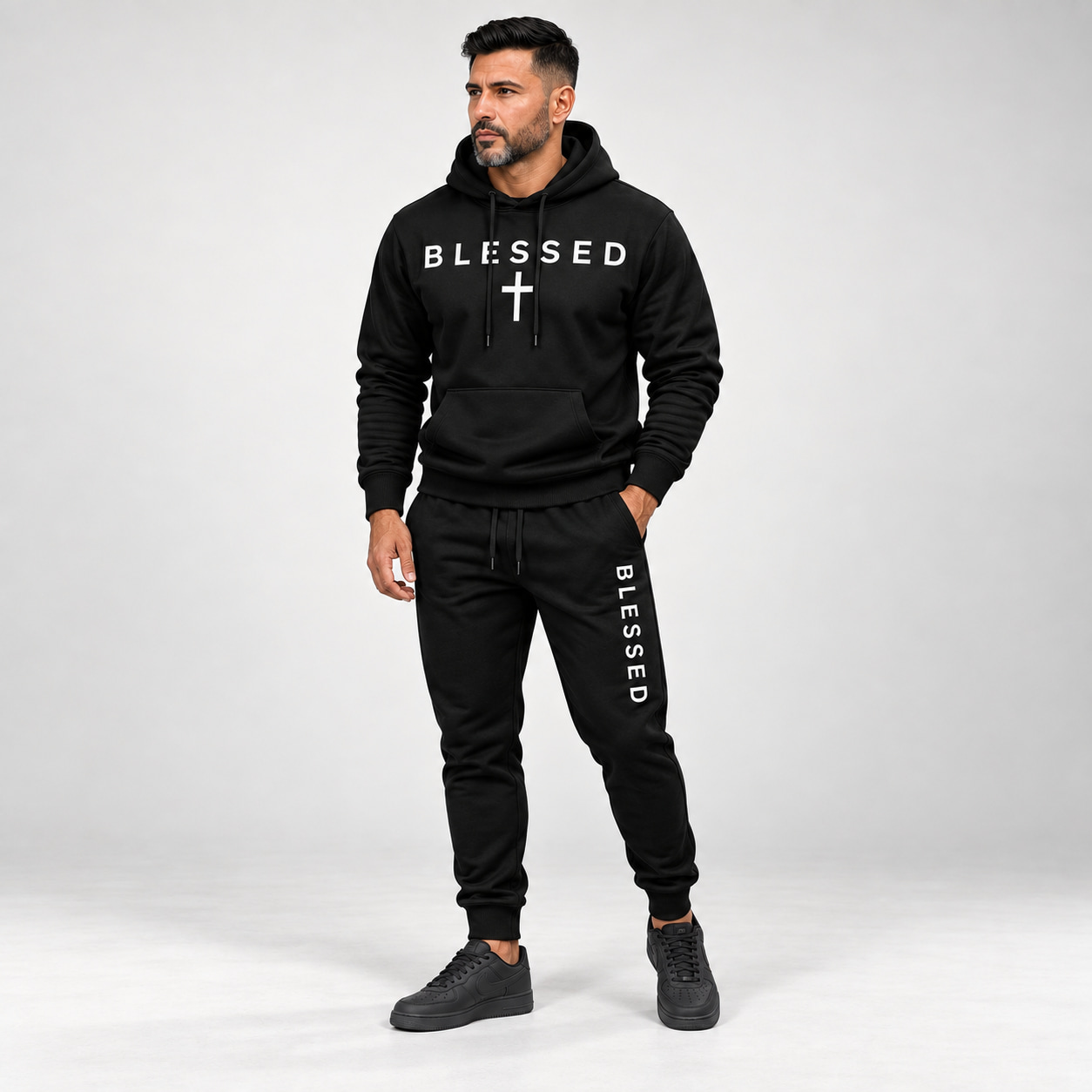 Adult male wearing the Black BLESSED hoodie and jogger set