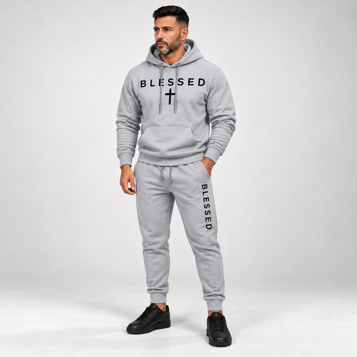 Adult male wearing the Light Gray BLESSED hoodie and jogger set