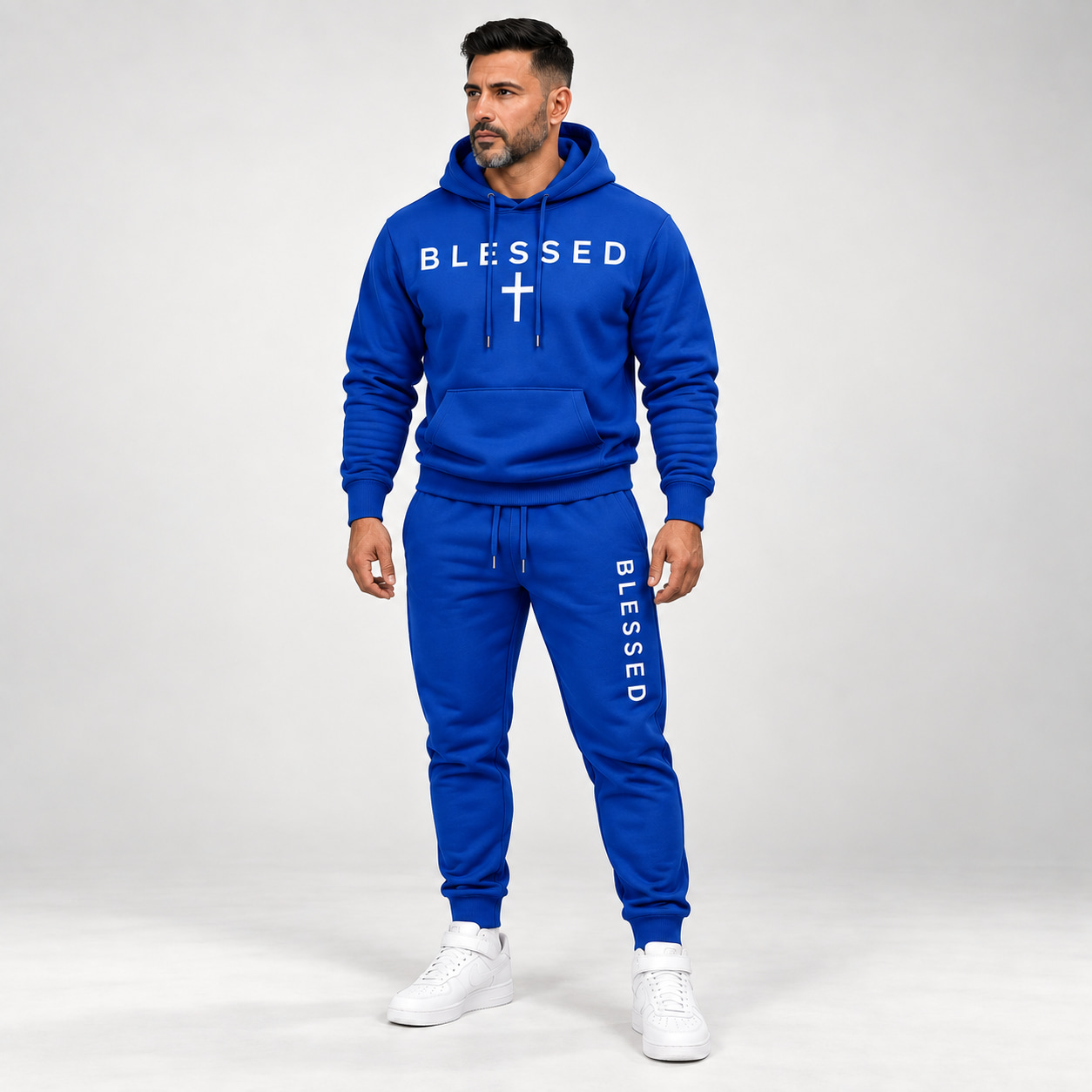 Adult male wearing the Blue BLESSED hoodie and jogger set
