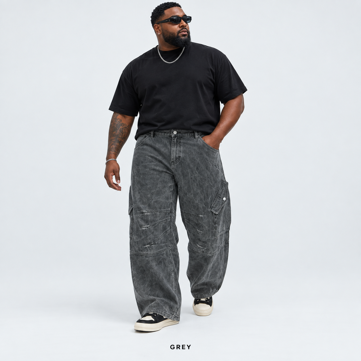 Men's Grey overdyed baggy utility cargo pants worn by an adult model